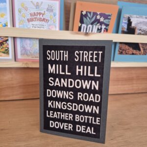 Deal Bus Blind card saying "mill Hill, Sandown, Downs Road, Kingsdown" white writing on black
